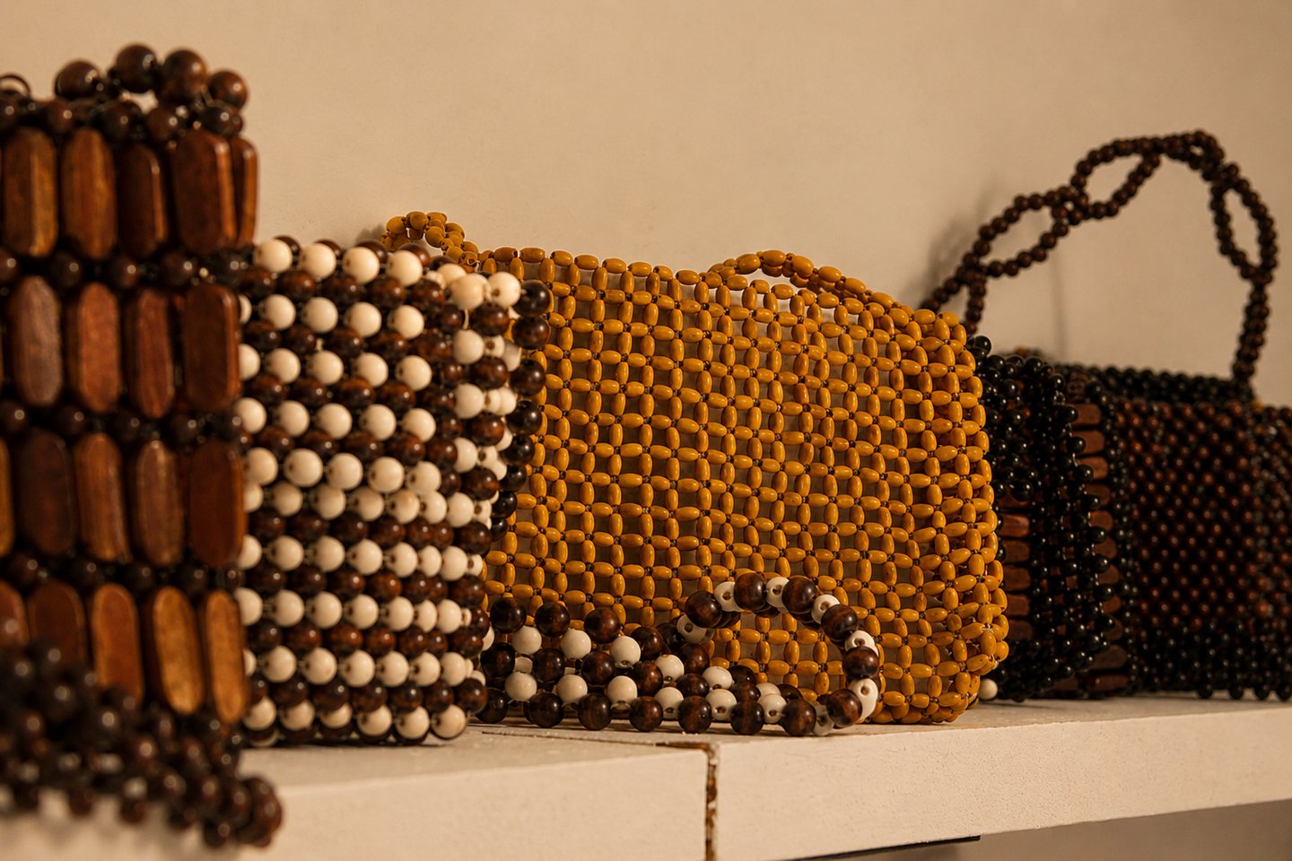 Several handcrafted bags gathered in one warm-toned composition.